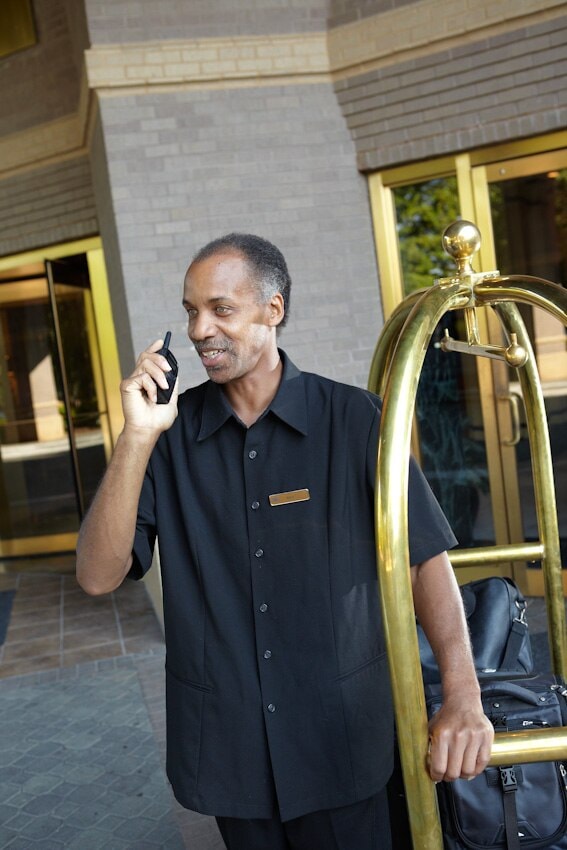 Hotel bellman using two-way radio
